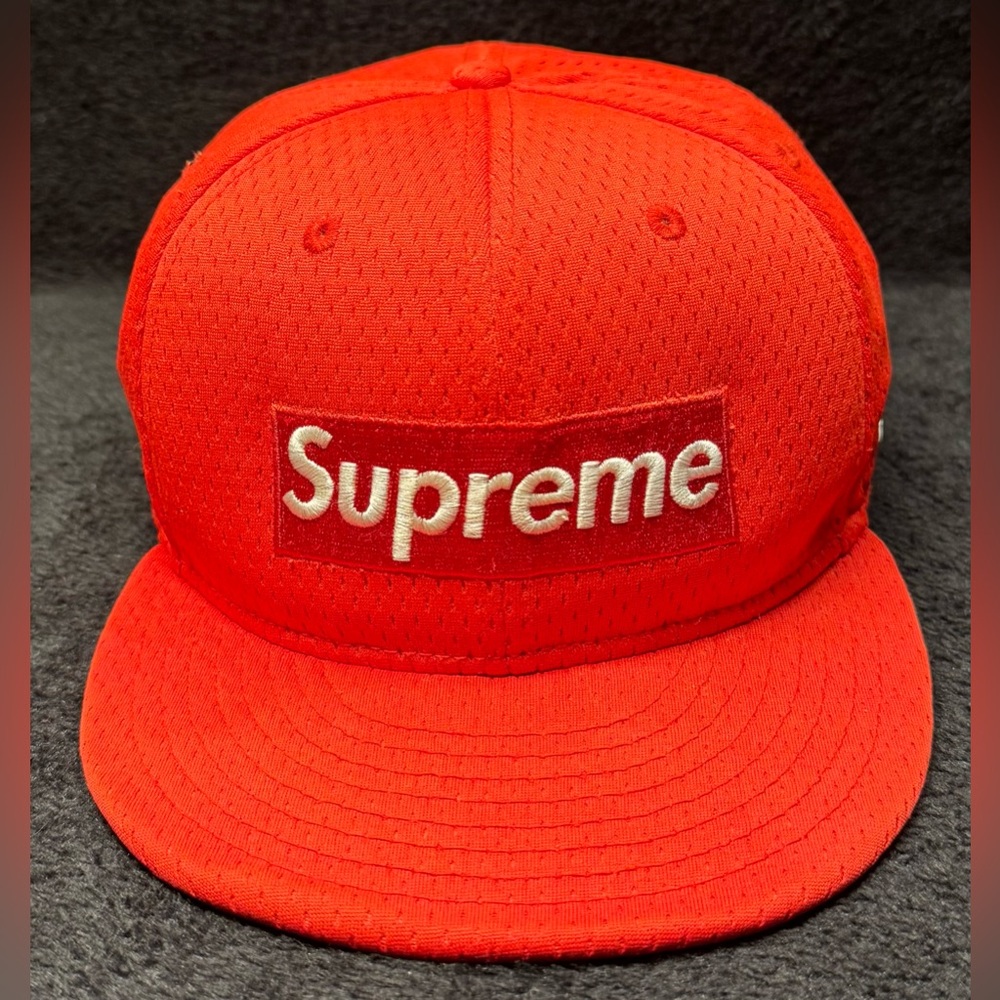 Supreme new era red baseball cap.  Used in great condition.